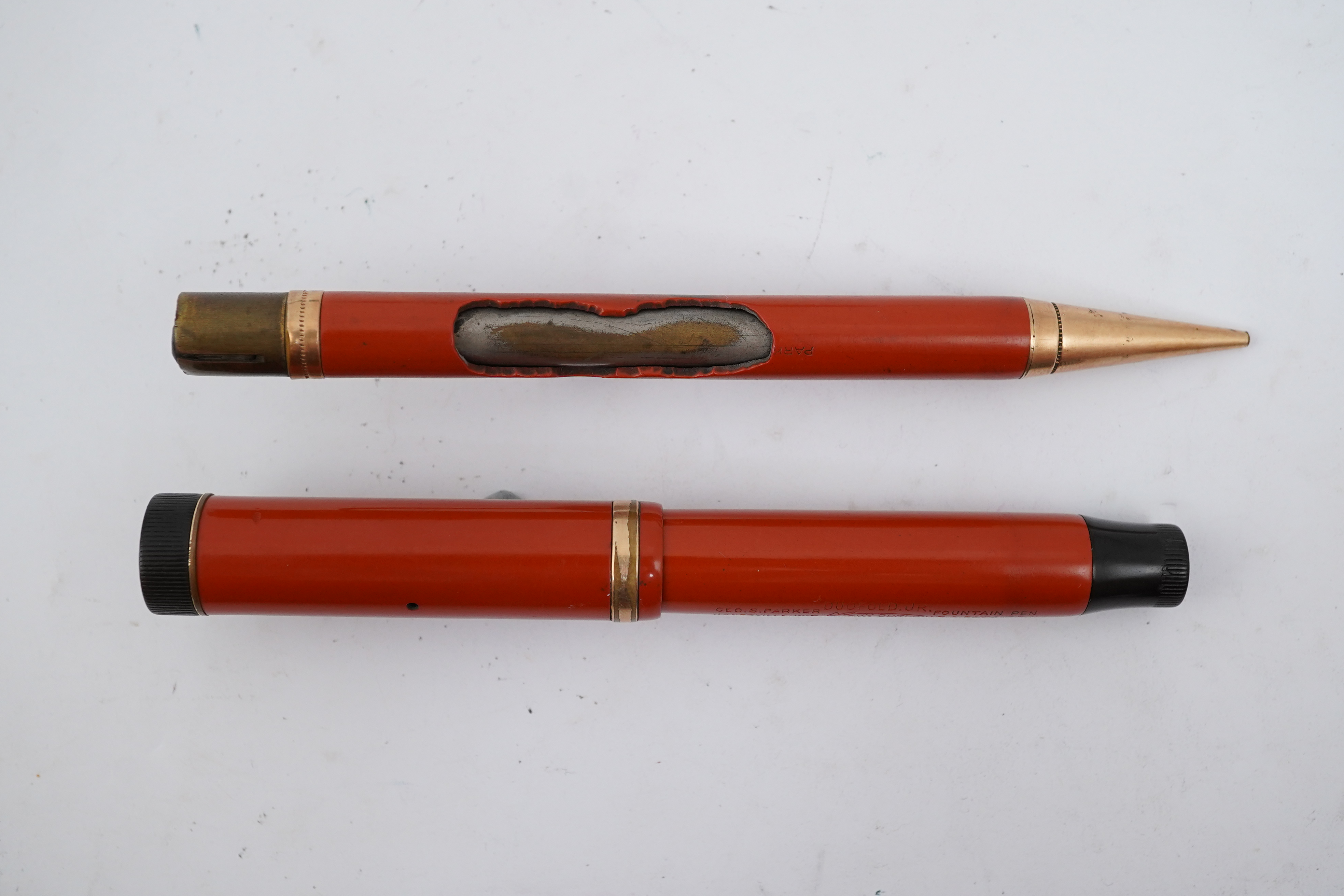 A Parker Duofold Lucky Curve fountain pen, and matching propelling pencil. Condition - poor